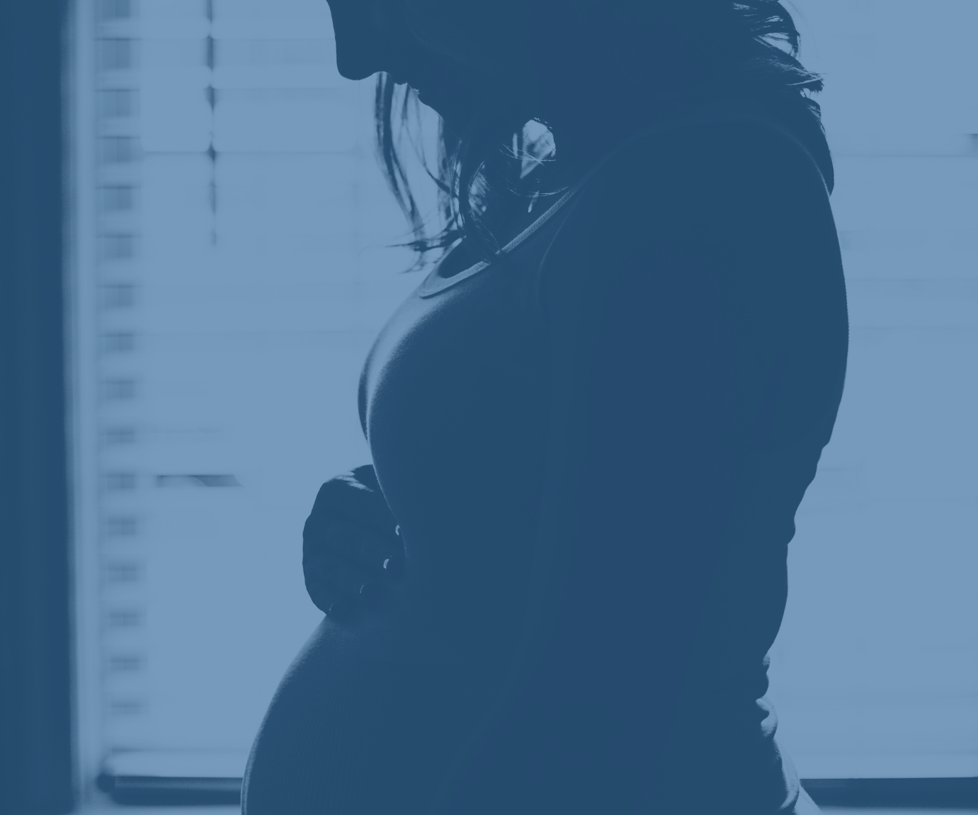 Peer Mentors - Pregnant lady holds bump
