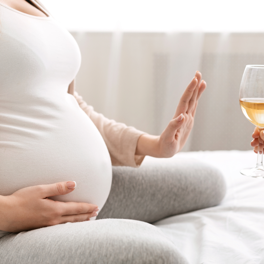 a pregnant lady refusing alcohol